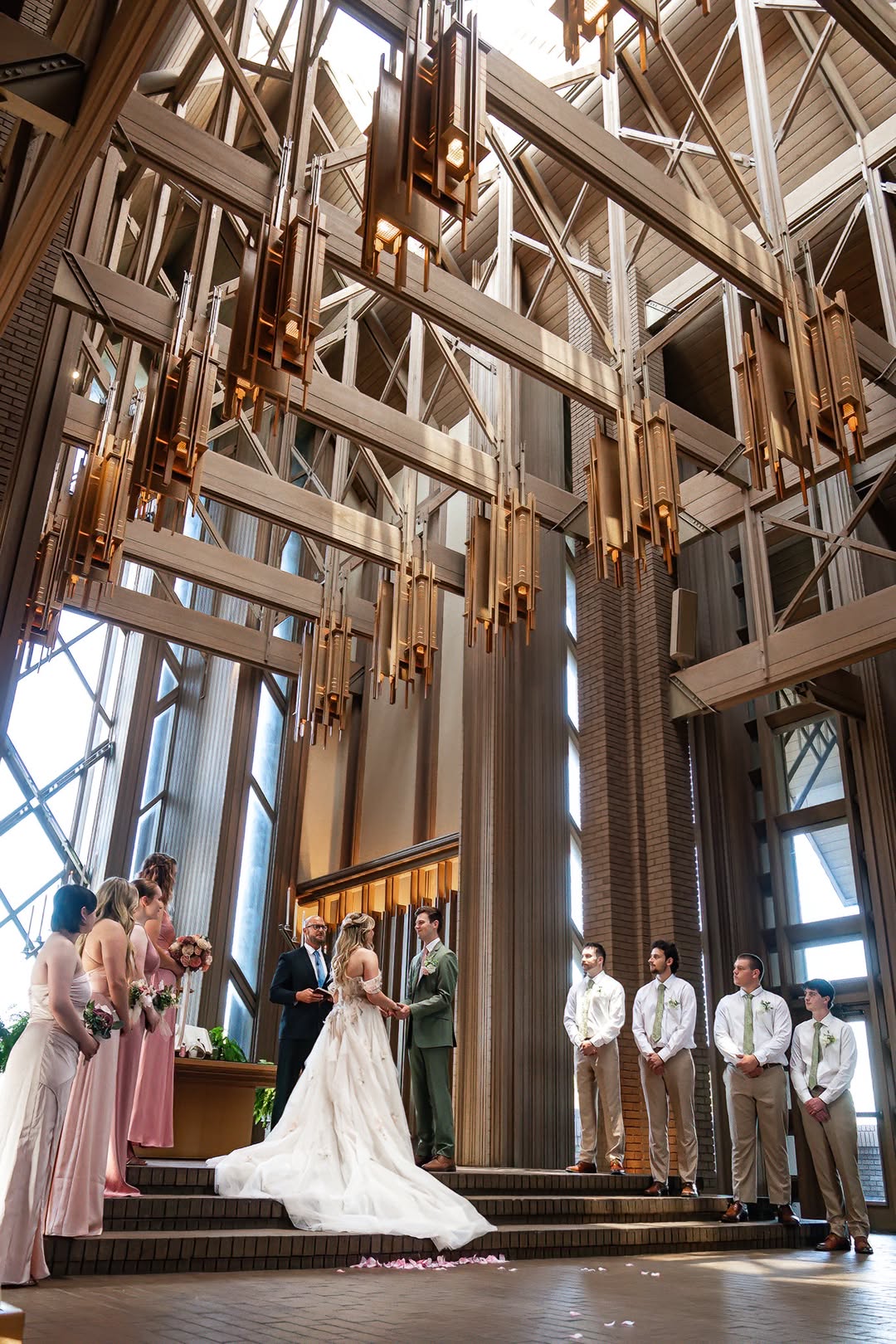 Wedding ceremony beneath the soaring chapel architecture